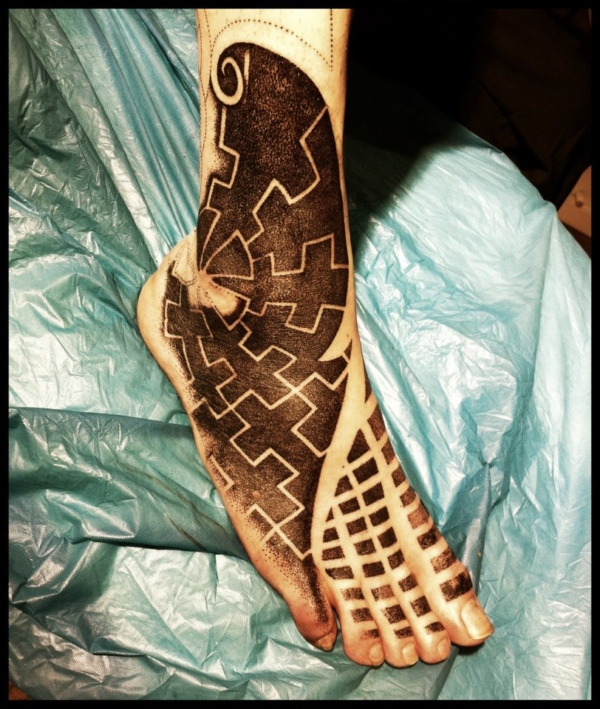 swastika_foot__wip_by_meatshop_tattoo-d5o004s