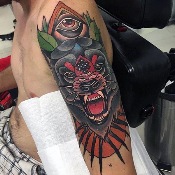 Wolf arm tattoo with all-seeing eye